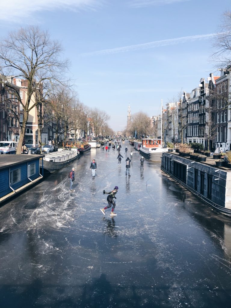 People iceskating on the canals of Amsterdam