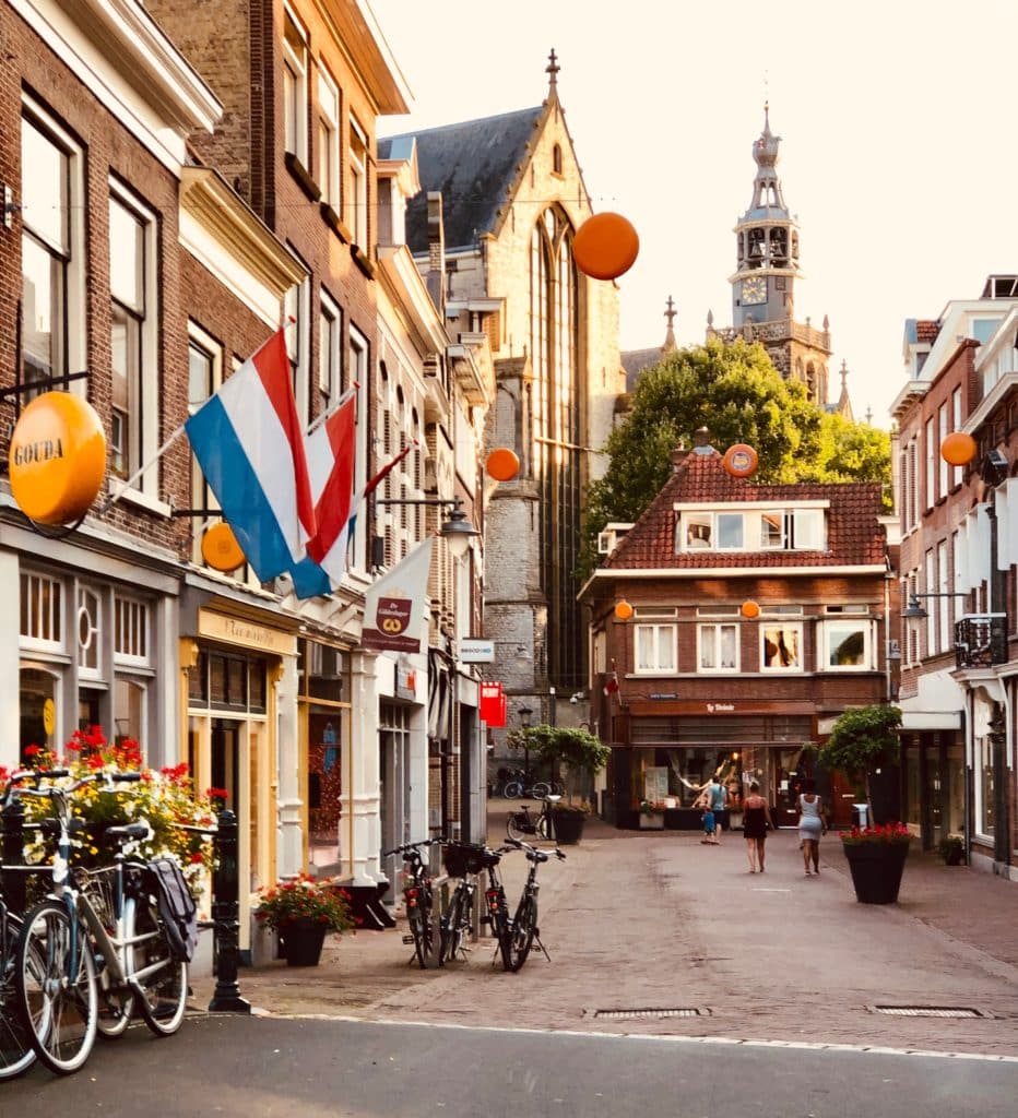 Typical street in Holland with Dutch flags